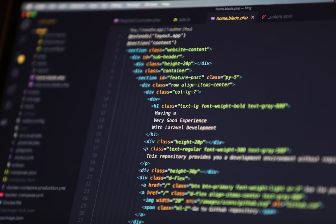 Software code on dark monitor screen